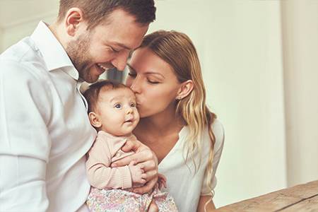 mom and dad with baby have peace of mind with identity theft protection