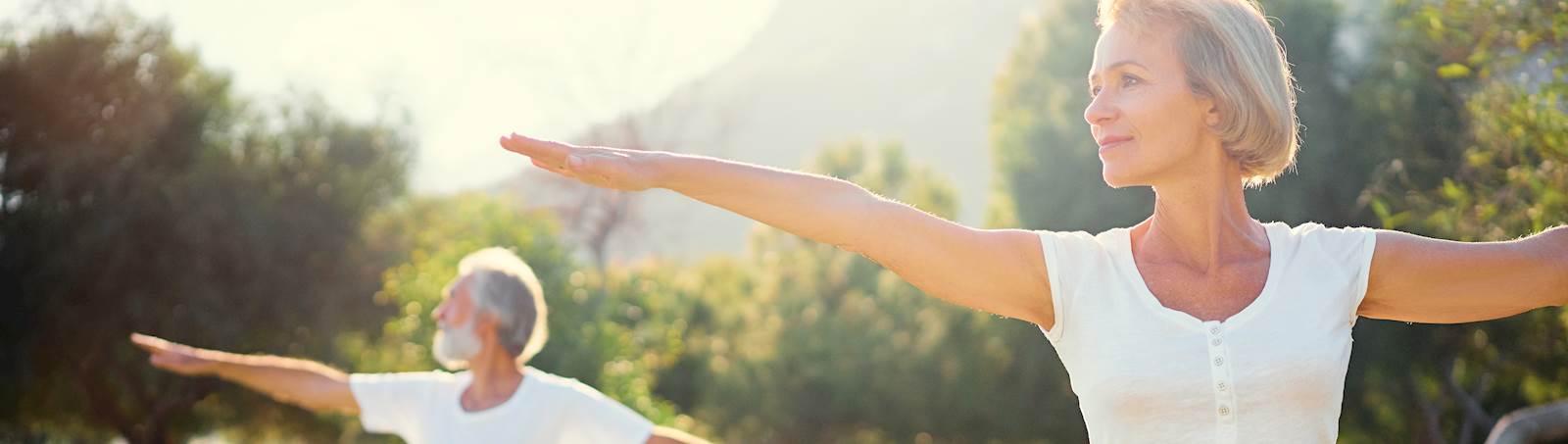 woman using health savings accounts benefits doing yoga outside